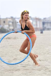 Estella Warren in a bikini with a hula hoop in Venice Beach on August 12, 2014