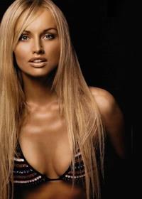 Adriana Karembeu in a bikini