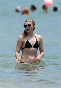 Chloe Grace Moretz candids in a Black Bikini in Miami Beach