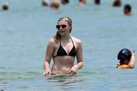 Chloe Grace Moretz candids in a Black Bikini in Miami Beach