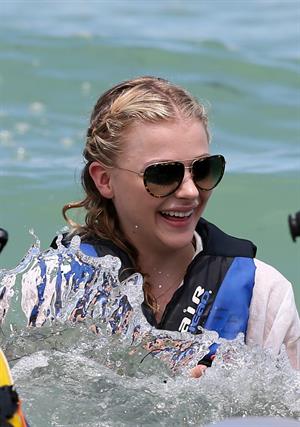 Chloe Grace Moretz candids in a Black Bikini in Miami Beach