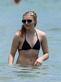 Chloe Grace Moretz candids in a Black Bikini in Miami Beach