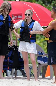 Chloe Grace Moretz candids in a Black Bikini in Miami Beach