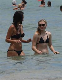 Chloe Grace Moretz candids in a Black Bikini in Miami Beach