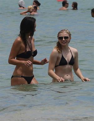 Chloe Grace Moretz candids in a Black Bikini in Miami Beach