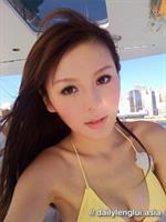 Jeana Ho in a bikini taking a selfie