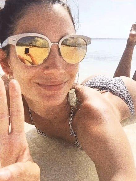 Lily Aldridge in a bikini taking a selfie