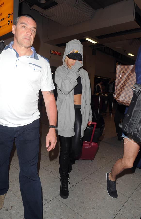 Rita Ora catches a flight at Heathrow Airport in London (27.06.2013) 