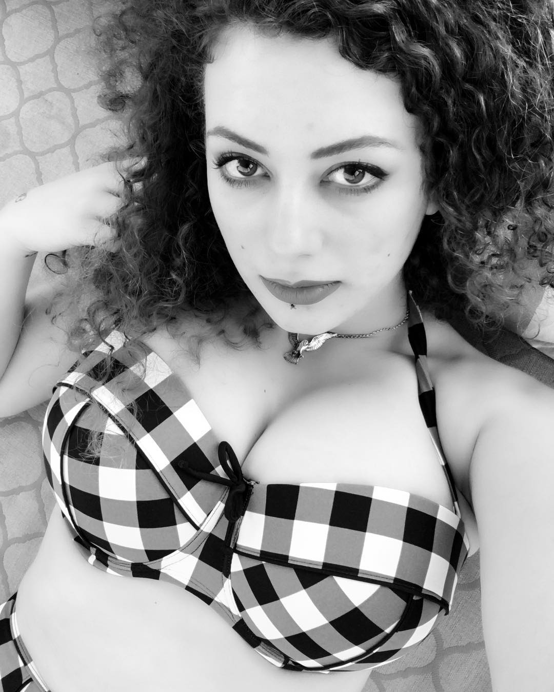 Leila Lowfire in a bikini taking a selfie