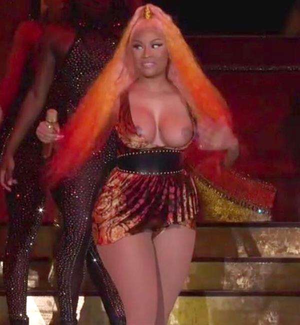 Nicki Minaj double nip slip and boobs flash wardrobe malfunction on stage.