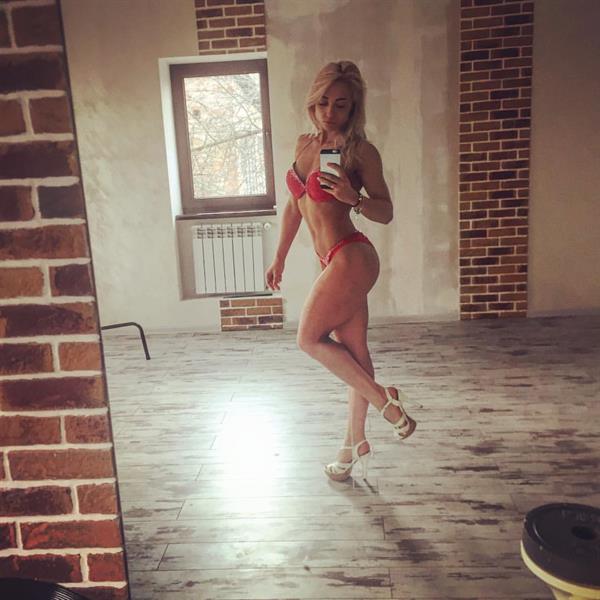 Anastasiia Dobrosol in a bikini taking a selfie