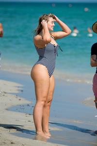 Iskra Lawrence in a swimsuit on Miami beach doing a photoshoot for Aerie on 11/26/2018