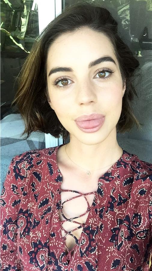 Adelaide Kane taking a selfie