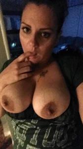 Nancy Ace taking a selfie and - breasts