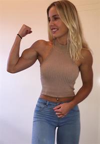 Emma Hartley flexing her bicep