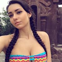 Helga Lovekaty in a bikini taking a selfie