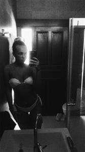 stina jonsson in a bikini taking a selfie
