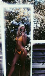 stina jonsson in a bikini taking a selfie