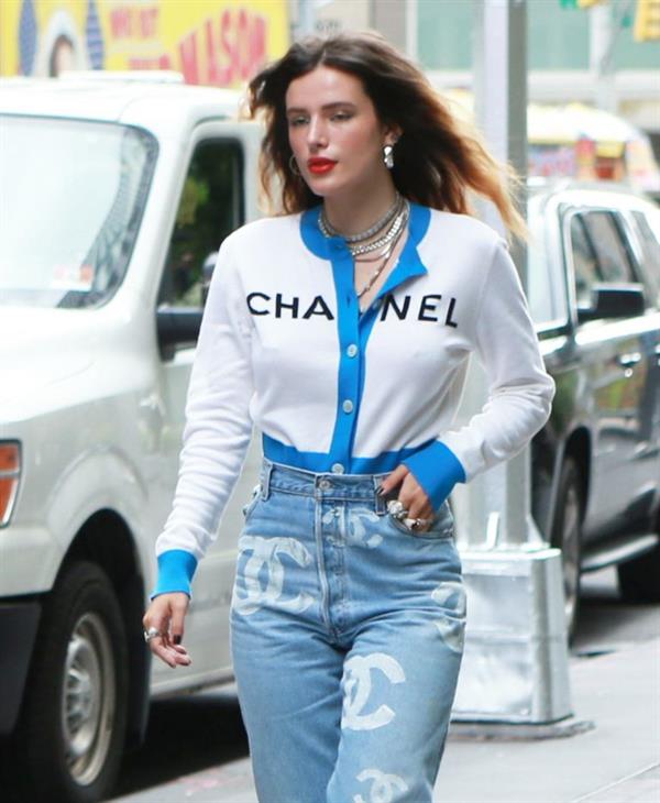 Bella Thorne braless tits seen by paparazzi showing her pierced nipple dressed all in Chanel.







