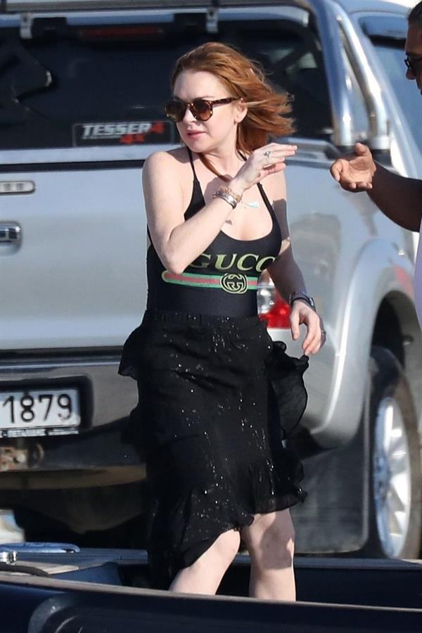 Lindsay Lohan showing nice cleavage with her big boobs in a Gucci swimsuit seen by paparazzi.






















