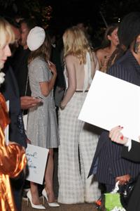 Ellie Bamber braless boobs while wearing basically a scarf as a top showing side boob cleavage.








