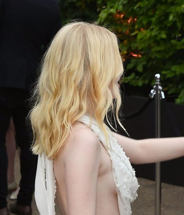 Ellie Bamber braless boobs while wearing basically a scarf as a top showing side boob cleavage.








