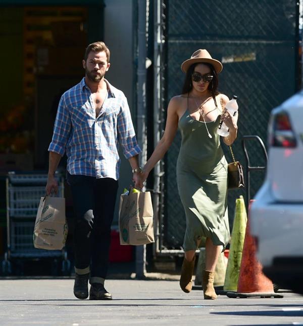 Nikki Bella braless boobs in a green dress seen by paparazzi.
















