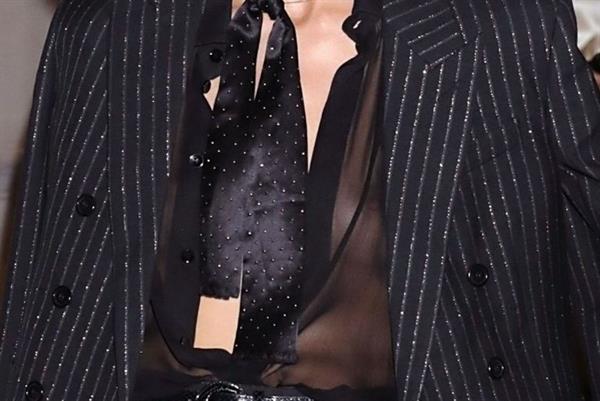 Anja Rubik sexy braless see through top showing her tits seen by paparazzi.





