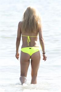Michelle Hunziker areola peek sexy perfect body in a bikini at the beach seen by paparazzi.
















