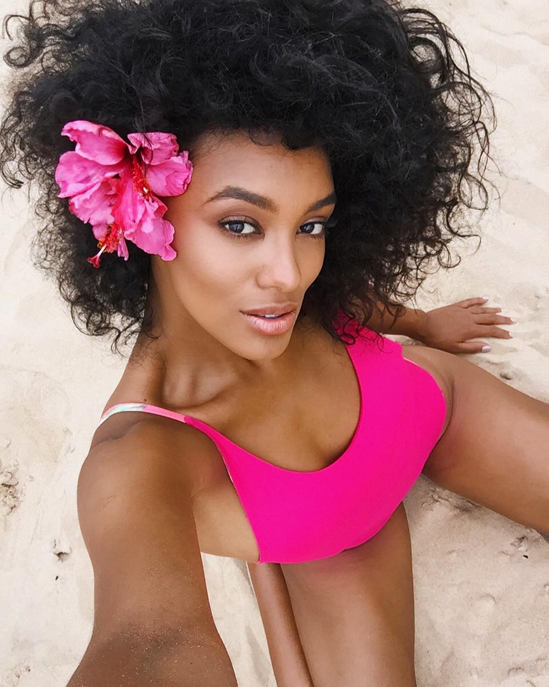 Raissa Santana in a bikini taking a selfie