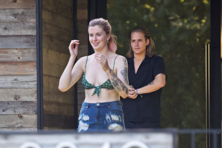 Ireland Baldwin Pictures Ireland Baldwin sexy in a bikini top seen by paparazzi showing some nice cleavage.