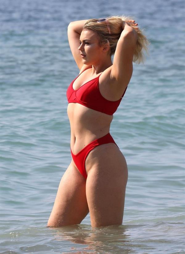 Tallia Storm sexy in a red bikini seen by paparazzi at the beach.











