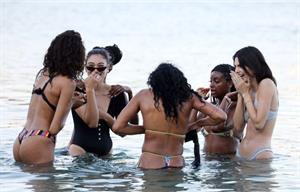 Kendall Jenner sexy ass in a thong bikini seen by paparazzi in the water at the beach.




























