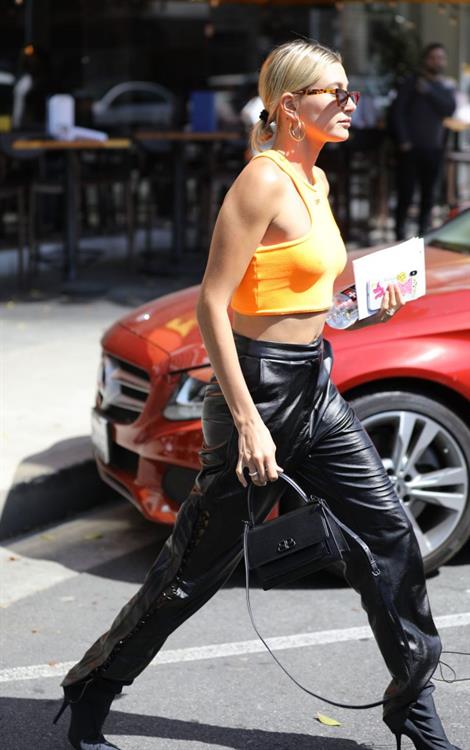 Hailey Bieber Pictures Hailey Bieber braless tits pokies seen by paparazzi in a halter top.