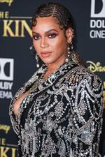 Beyonce braless boobs and areola peek showing off nice cleavage on the red carpet for the premiere of  The Lion King .






