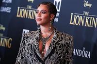 Beyonce braless boobs and areola peek showing off nice cleavage on the red carpet for the premiere of  The Lion King .






