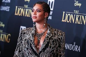 Beyonce braless boobs and areola peek showing off nice cleavage on the red carpet for the premiere of  The Lion King .






