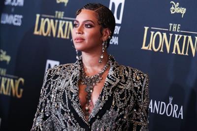 Beyonce braless boobs and areola peek showing off nice cleavage on the red carpet for the premiere of  The Lion King .






