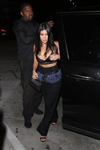 Kourtney Kardashian sexy cleavage in a black top seen by paparazzi.













