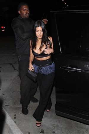Kourtney Kardashian sexy cleavage in a black top seen by paparazzi.













