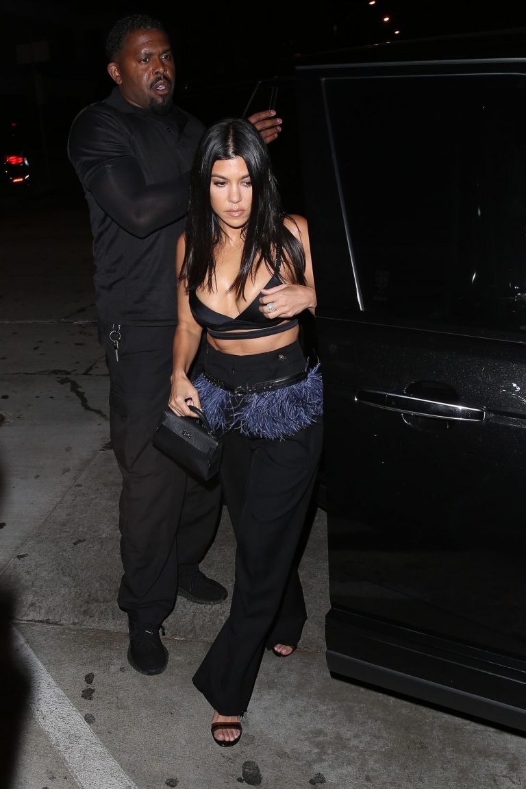 Kourtney Kardashian Pictures Kourtney Kardashian sexy cleavage in a black top seen by paparazzi.