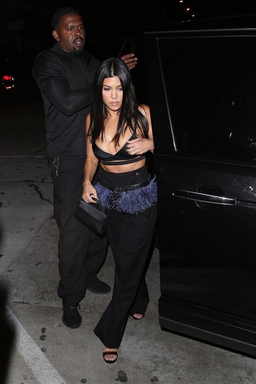 Kourtney Kardashian Pictures Kourtney Kardashian sexy cleavage in a black top seen by paparazzi.