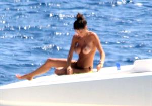Francesca Sofia Novello caught topless by paparazzi tanning with her nude boobs exposed.
