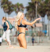 WWE Diva Lana or CJ Perry sexy boobs and ass in a bikini seen at the beach by paparazzi.










