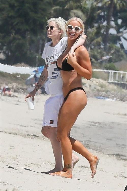 Gigi Gorgeous Bikini Pictures Gigi Gorgeous sexy cleavage in a bikini at the beach with Nats Getty seen by paparazzi.