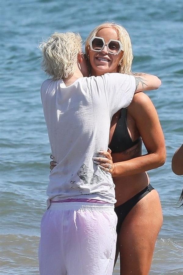 Gigi Gorgeous sexy cleavage in a bikini at the beach with Nats Getty seen by paparazzi.



