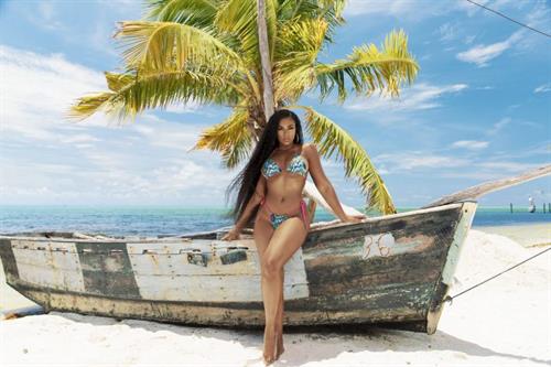 Ashanti sexy thong bikini photo shoot showing some nice cleavage.






