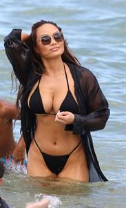 Daphne Joy sexy ass and boobs in a thong bikini at the beach seen by paparazzi showing nice cleavage and booty.
