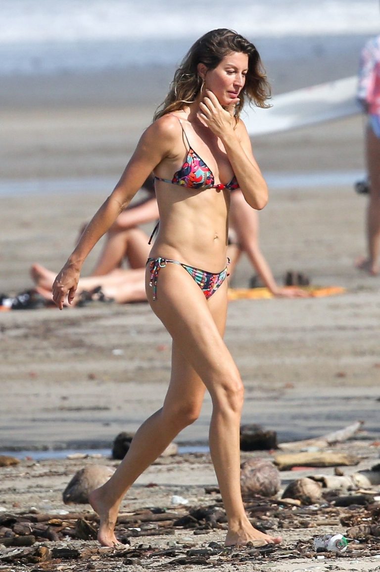 Gisele Bündchen Bikini Pictures Gisele Bundchen sexy ass in a thong bikini at the beach seen by paparazzi with Tom Brady.