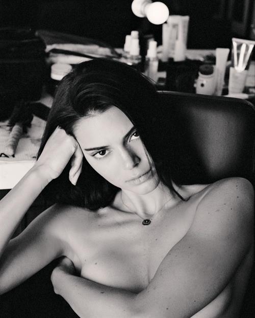 Kendall Jenner Pictures Kendall Jenner nude photo covering her topless boobs with her arm.